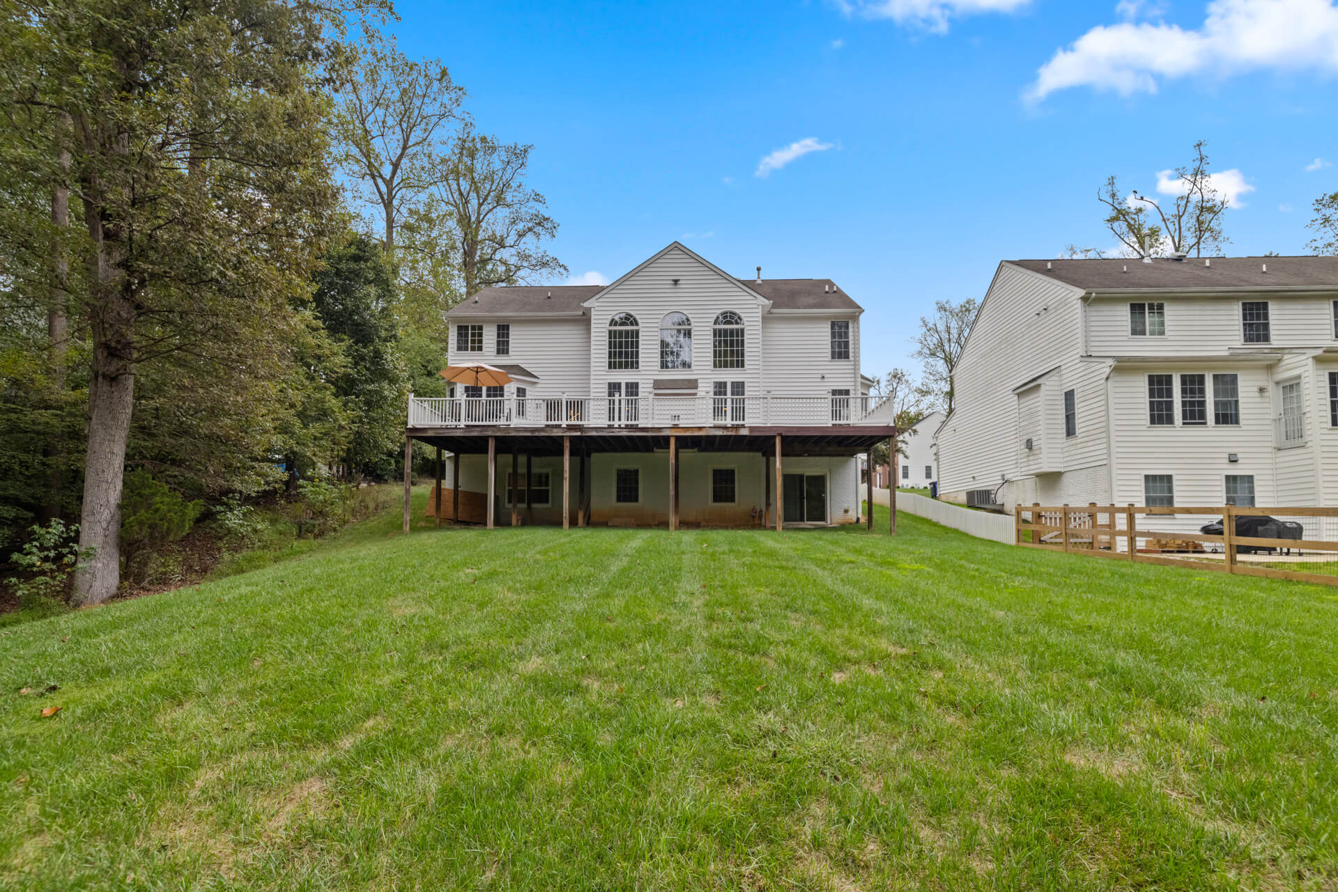 Expansive backyard with a large, secure deck for residents to enjoy.