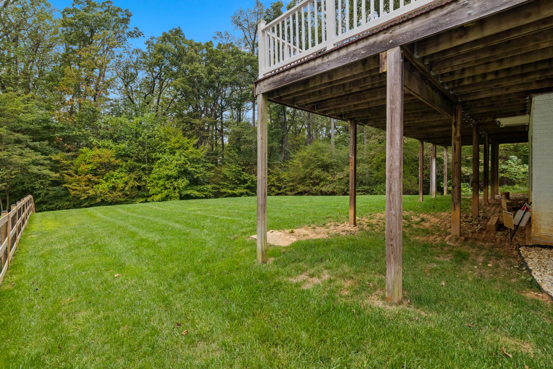 View of the shaded lawn area from beneath the deck.