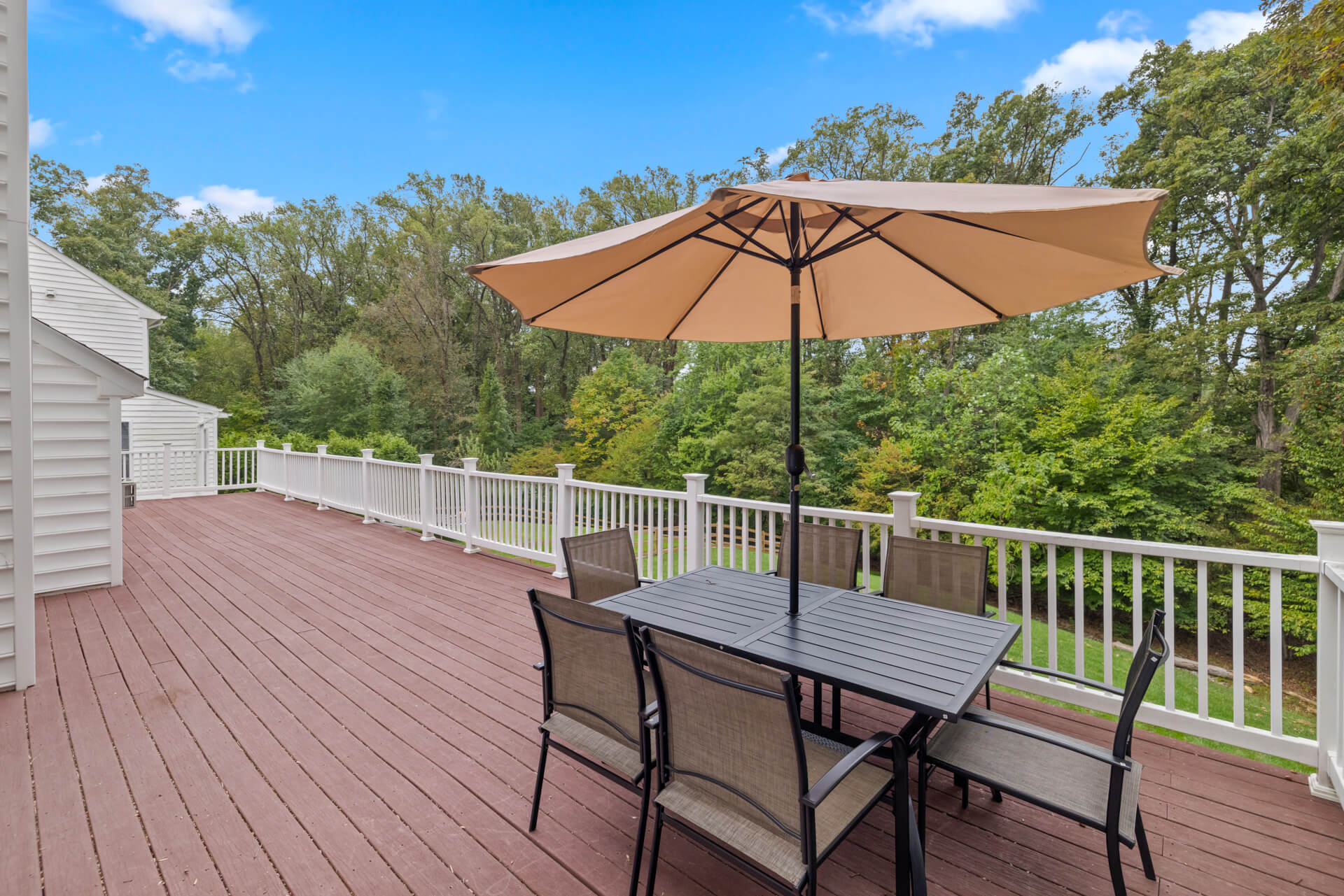 Spacious outdoor deck with comfortable seating for residents and families.